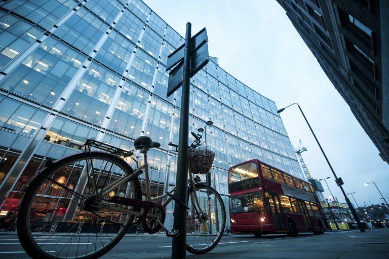 Bicycle and bus on city street